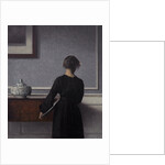 Interior with Young Woman from Behind by Vilhelm Hammershøi