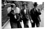 Nora Barnacle (left), James Joyce (center) and their solicitor n London on the day of their marriage by Anonymous