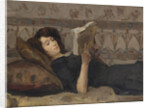 Girl reading on a sofa, c. 1920 by Anonymous