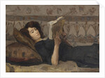 Girl reading on a sofa, c. 1920 by Anonymous