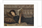 Girl reading on a sofa, c. 1920 by Anonymous