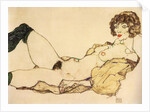 Lying nude with green stockings, 1917 by Anonymous