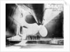 Workmen standing under one of the propellors of the Titanic, 31 May, 1911 by Anonymous