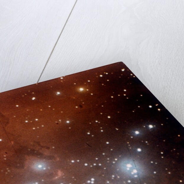 Nebulosity and star cluster in Serpens by NASA