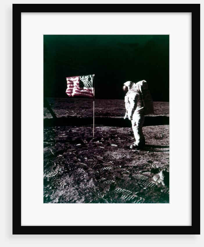 Buzz Aldrin stands next to the American flag on the surface of the Moon, July 1969 by Neil Armstrong
