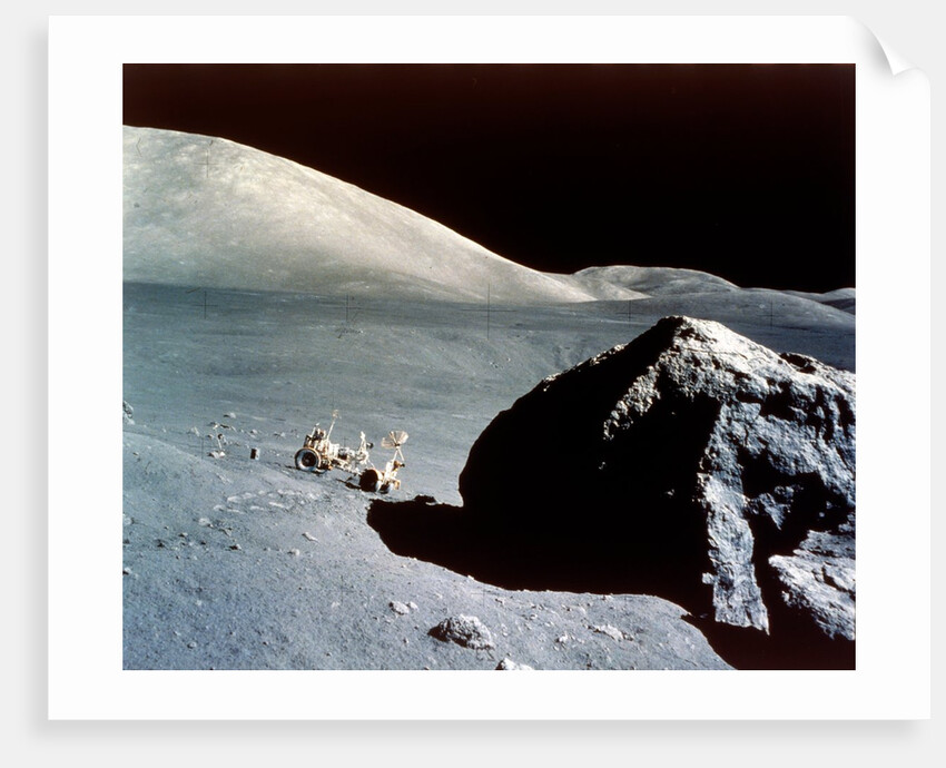 The Rover is dwarfed by a giant rock on the lunar surface, Apollo 17 mission, December 1972 by NASA