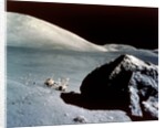 The Rover is dwarfed by a giant rock on the lunar surface, Apollo 17 mission, December 1972 by NASA