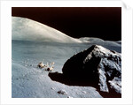 The Rover is dwarfed by a giant rock on the lunar surface, Apollo 17 mission, December 1972 by NASA