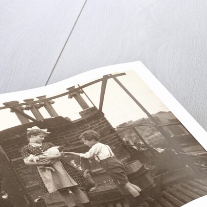 Marba (?) And Eckart Titzenthaler, children of the photographer, on the roof of the house Friedrichstrasse, Berlin, with a cock, Germany by Waldemar Titzenthaler