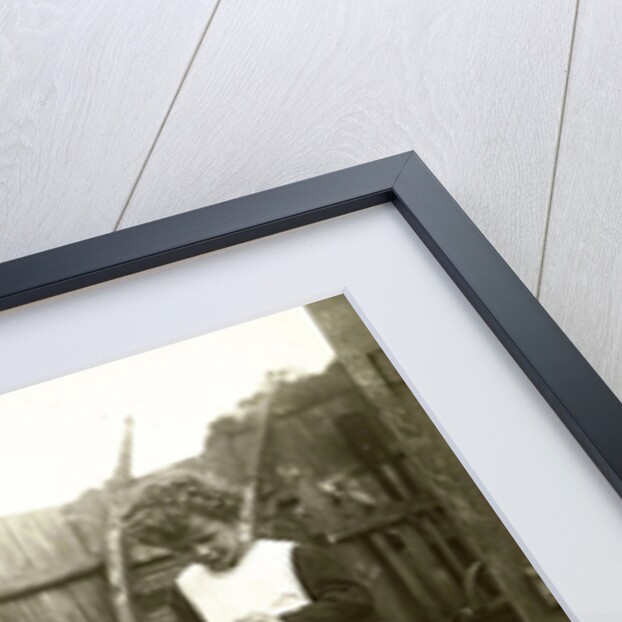 Eckart Titzenthaler, son of the photographer standing on a farm with chickens and geese by Waldemar Titzenthaler