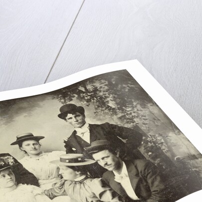 Group portrait of three men and three women, sitting in a studio with painted cloth background (forest or park scene) by Anonymous