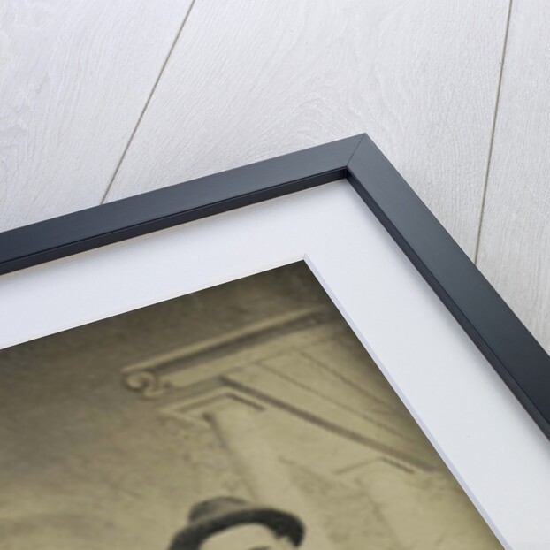 Portrait of four men sitting and standing in front of a painted backdrop, architecture by Anonymous