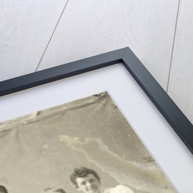 Group portrait of two men and three women, standing and sitting in front of a painted backdrop, tree, rocks by Anonymous