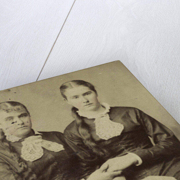 Portrait of two women sitting next to each other and holding each other's hand by Anonymous