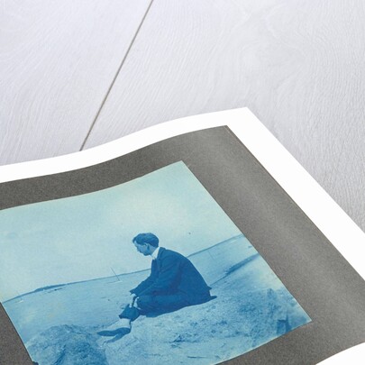 Man in profile, sitting on a rock by the sea, United States, Cyanotype, a photographic printing process that produces a cyan-blue print by Anonymous