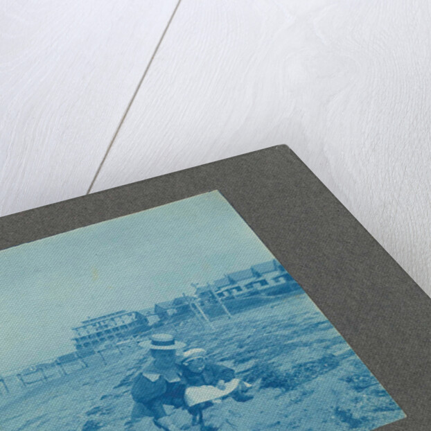 Woman with a child on the beach, USA by Anonymous