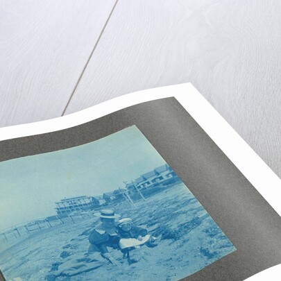 Woman with a child on the beach, USA by Anonymous