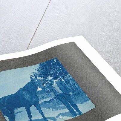 Man holds horse by the reins, United States, USA by Anonymous