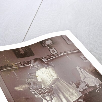 Portrait of Sacha, the eldest daughter of the photographer, in a room with toys by Henry Pauw van Wieldrecht