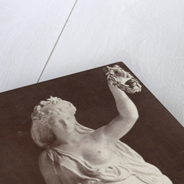 Marble statue of a woman in a robe with a bare chest, in her left hand she wears a laurel wreath in her right a ship's anchor by Louis-Emile Durandelle