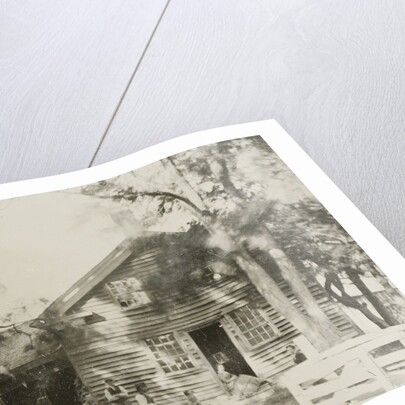 View of a wooden house, with five people and a dog by Anonymous