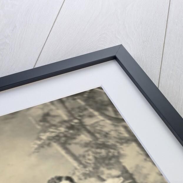 Two men and two women standing and sitting in front of a painted backdrop (forest) by Anonymous