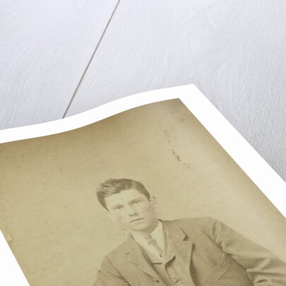 Two women and a man posing in a ferrotypietent by Anonymous