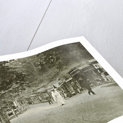 shops or stalls on the banks of a water by Anonymous