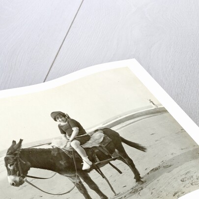 Girl on donkey on the beach (North Sea), the Netherlands or Germany by Anonymous