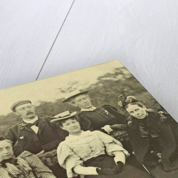 Group portrait of four women and one man around a table in the open air by Anonymous