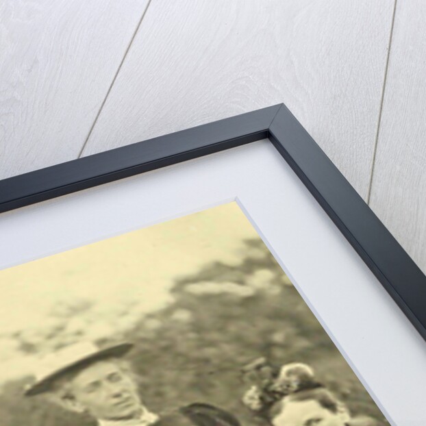 Group portrait of four women and one man around a table in the open air by Anonymous