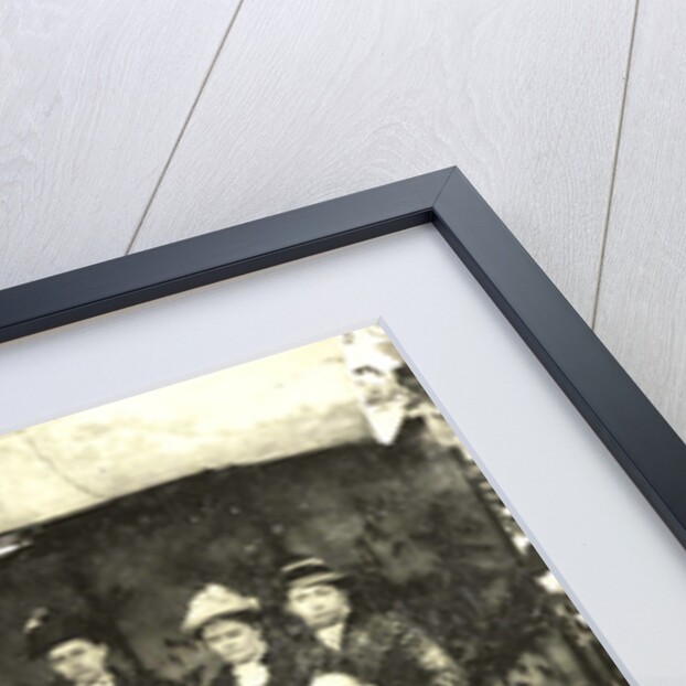 Group portrait of hikers in a makeshift studio by Anonymous
