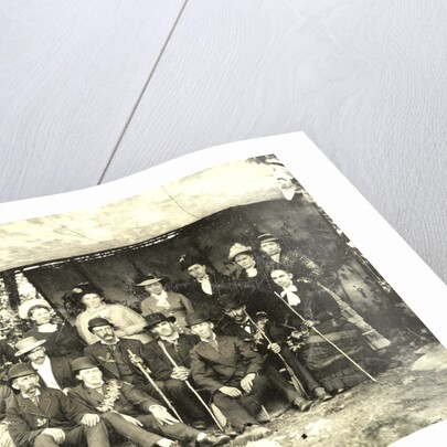 Group portrait of hikers in a makeshift studio by Anonymous