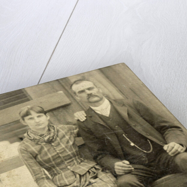 Portrait of a man and a woman sitting on a bench in front of their house (?) by Anonymous