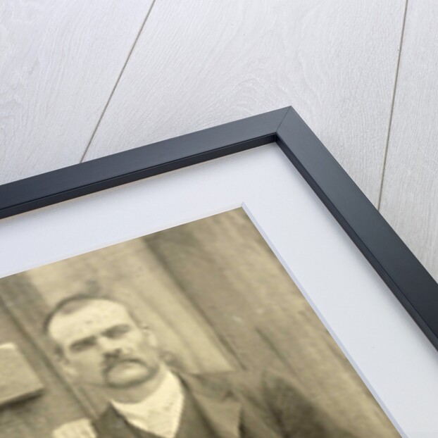 Portrait of a man and a woman sitting on a bench in front of their house (?) by Anonymous