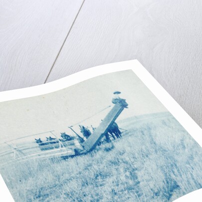 Farmers in a combine harvester, waiting laadkar by Anonymous