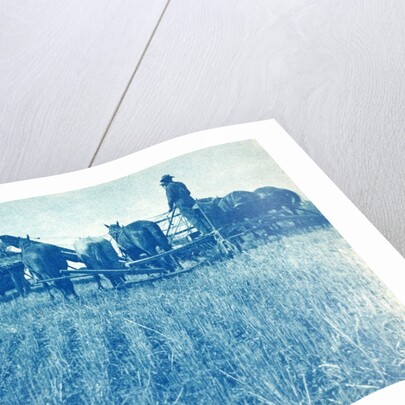 Farmers with a combine harvester pulled by horses by Anonymous