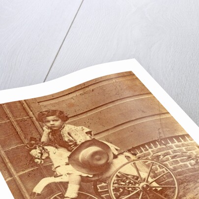 Louis Asser, son of the photographer, on a tricycle by Eduard Isaac Asser