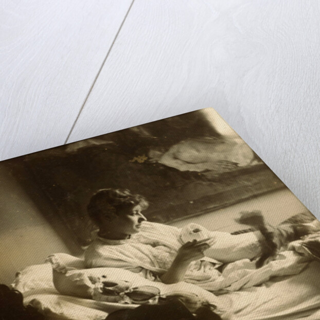 Marie Jordan dressed sitting in bed with a cup in her hands by George Hendrik Breitner