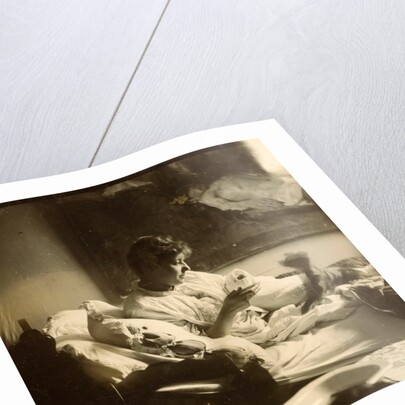 Marie Jordan dressed sitting in bed with a cup in her hands by George Hendrik Breitner