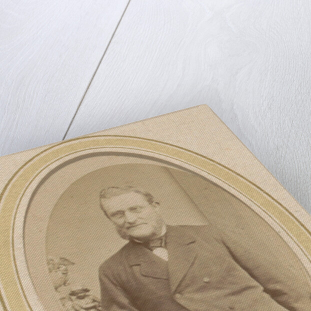 Portrait of a leaning man with a beard and glasses by J. Ephraim