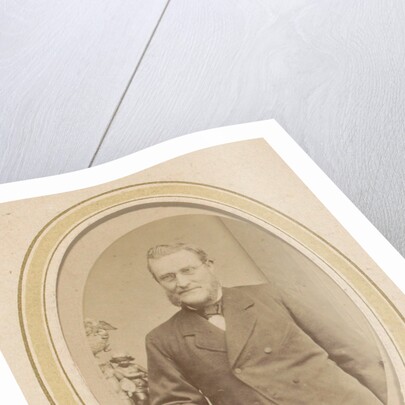 Portrait of a leaning man with a beard and glasses by J. Ephraim