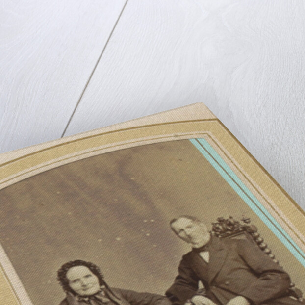 Portrait of a woman in a dress with headdress and a seated man by J.C. Reesinck