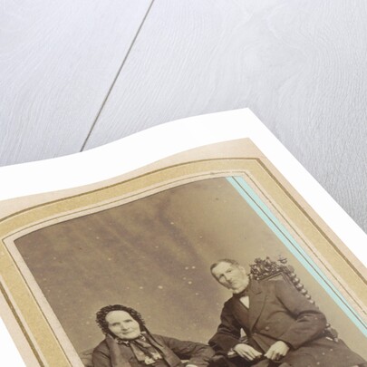 Portrait of a woman in a dress with headdress and a seated man by J.C. Reesinck