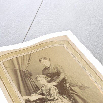Portrait of a girl in a dress with tartan and a woman in a dress at a table with books by Anonymous