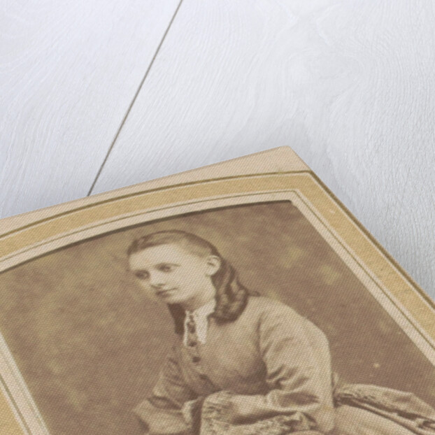 Portrait of a Young Woman in a dress leaning on a chair by De Lavieter & Co.