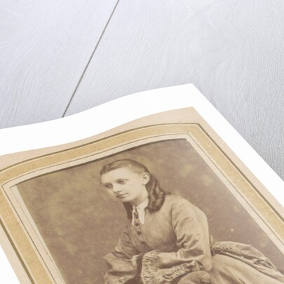 Portrait of a Young Woman in a dress leaning on a chair by De Lavieter & Co.