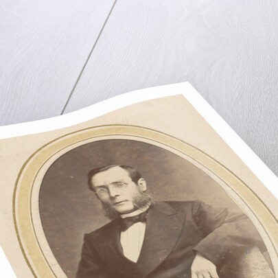 Portrait of a man with glasses by sideburns and a jacket