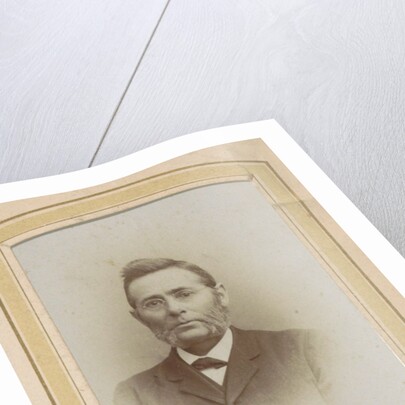 Portrait of a man with glasses and sideburns by J.C. Reesinck