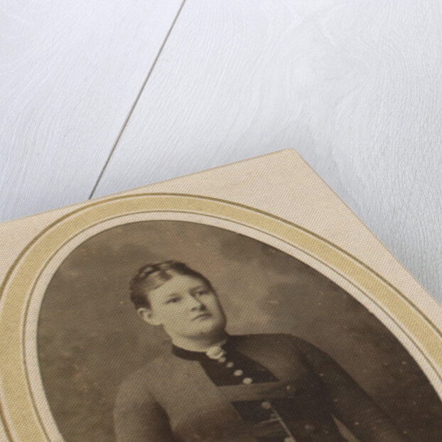 Portrait of a woman with upswept hair, a jacket with buttons and an ornament by J.H. van der Laag